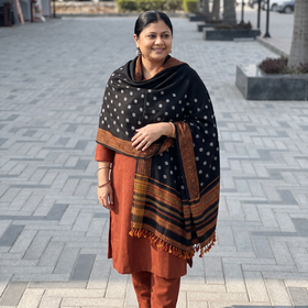 Black Kutch Handwoven Bandhani Merino Wool Shawl, worn by a model, AI visual of the shawl, iTokri