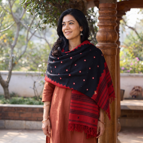 Black Kutch Handwoven Bandhani Mirror Work Merino Wool Shawl, worn by a model, AI visual of the shawl, iTokri