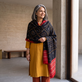 Black Kutch Handwoven Bandhani Tie-Dye Merino Wool Shawl, worn by a model, AI visual of the shawl, iTokri