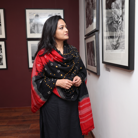Black Kutch Handwoven Bandhani Tie-Dye Merino Wool Shawl, worn by a model, AI visual of the shawl, iTokri