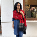 Red Kutch Handwoven Bandhani Tie-Dye Merino Wool Shawl, worn by a model, AI visual of the shawl, iTokri