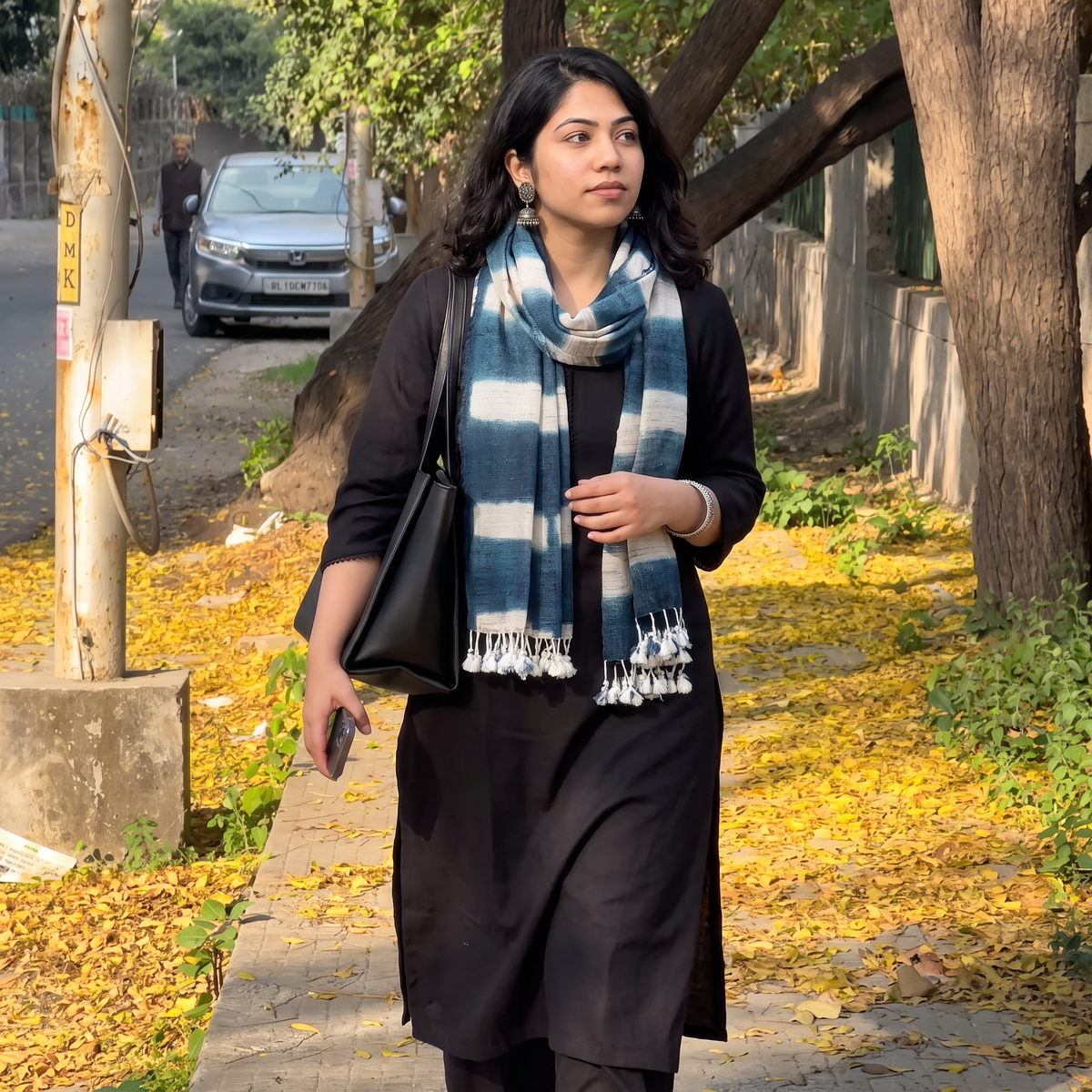 Blue Kutch Handwoven Clamp Dyed Merino Wool x Katia Silk Shibori Stole, worn by a woman, AI visual of the stole, iTokri
