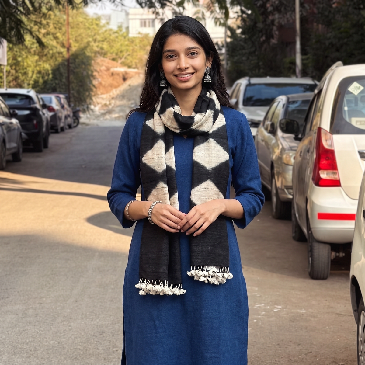 Black Kutch Handwoven Clamp Dyed Merino Wool x Katia Silk Shibori Stole, worn by a woman, AI visual of the stole, iTokri