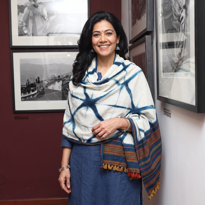 White Kutch Handwoven Clamp Dyed Shibori Merino Wool Shawl, worn by a model, AI visual of the shawl, iTokri