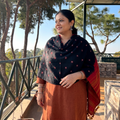 Black Kutch Handwoven Merino Wool Bandhani Tie-Dye Shawl, worn by a model, AI visual of the shawl, iTokri