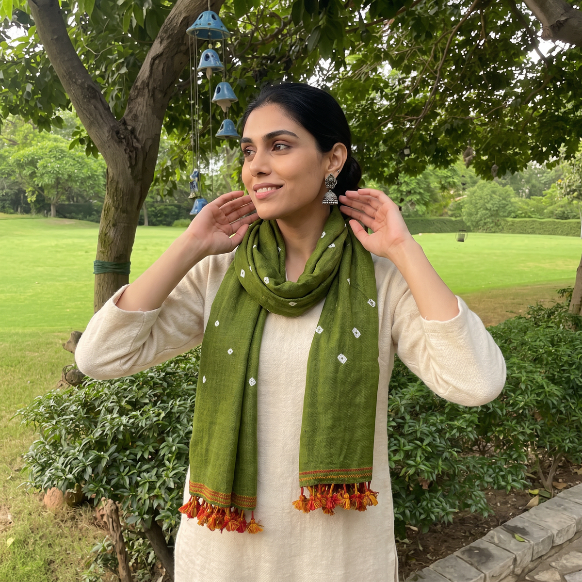 Green Kutch Handwoven Merino Wool Bandhani Tie-Dye Stole, worn by a woman, AI visual of the stole, iTokri