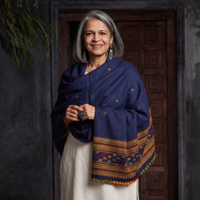 Blue Kutch Handwoven Merino Wool Dhabla Shawl, worn by a model, AI visual of the shawl, iTokri
