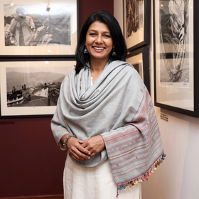 Grey Kutch Handwoven Merino Wool Shawl, worn by a model, AI visual of the shawl, iTokri