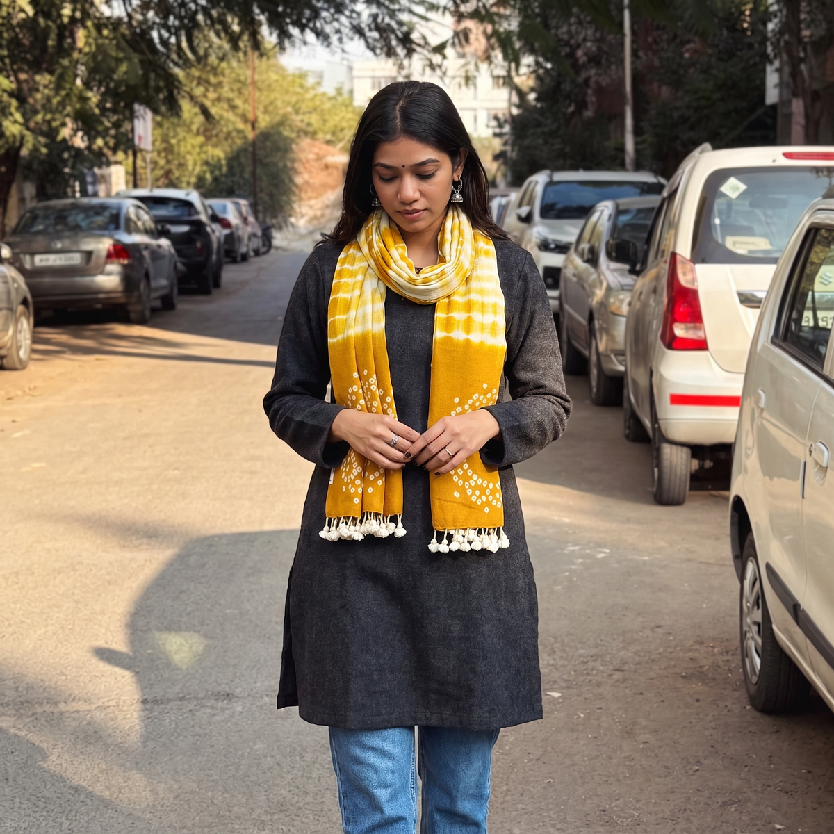 Yellow Kutch Handwoven Merino Wool Shibori & Bandhani Stole, worn by a woman, AI visual of the stole, iTokri