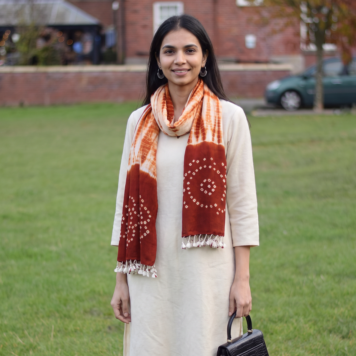 Red Kutch Handwoven Merino Wool Shibori & Bandhani Stole, worn by a woman, AI visual of the stole, iTokri