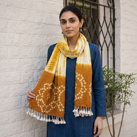 Yellow Kutch Handwoven Merino Wool Shibori & Bandhani Stole, worn by a woman, AI visual of the stole, iTokri