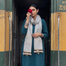 Grey Kutch Handwoven Merino Wool Stole, worn by a woman, AI visual of the stole, iTokri