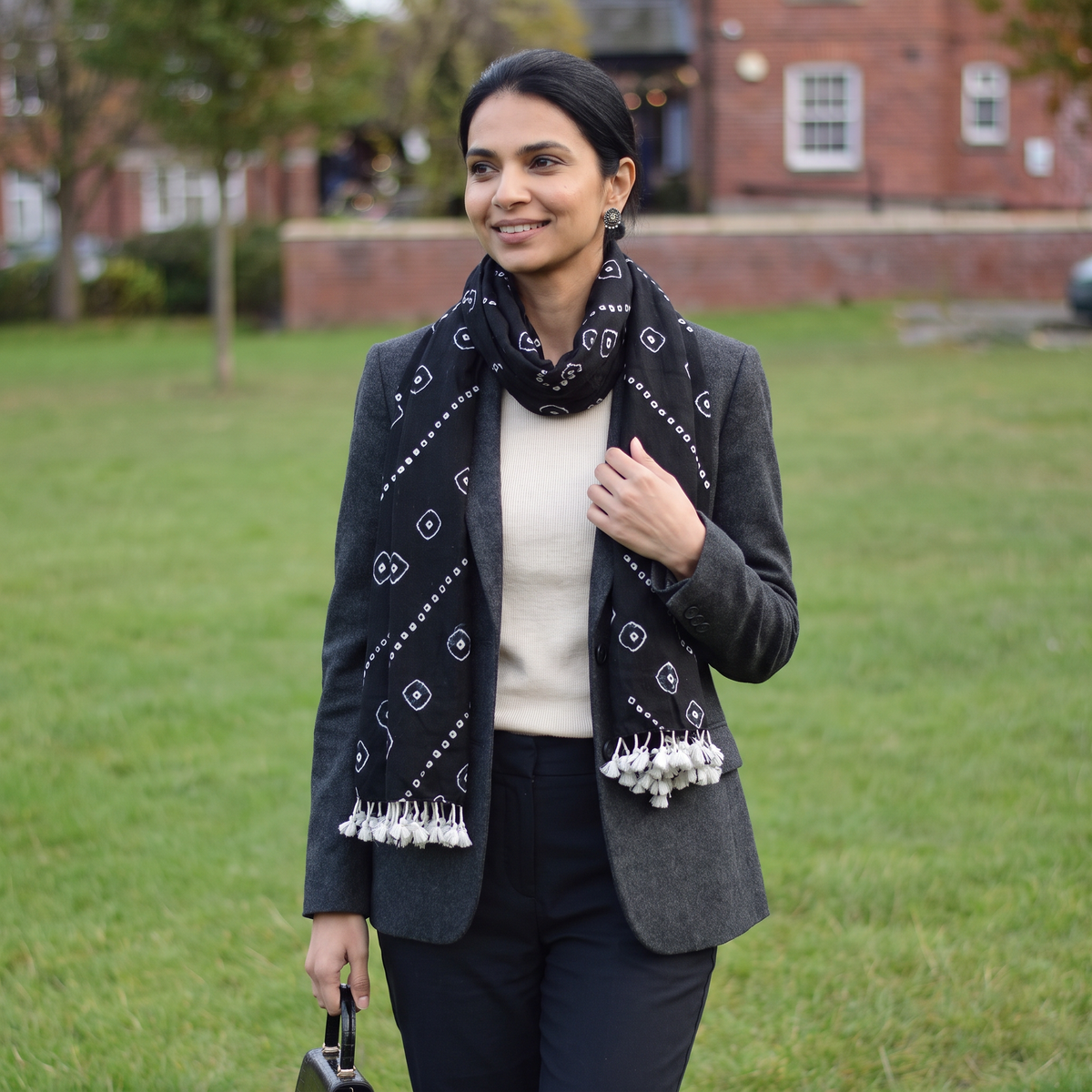 Black Kutch Handwoven Merino Wool Tie-Dye Bandhani Stole, worn by a woman, AI visual of the stole, iTokri