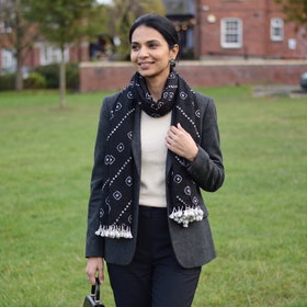 Black Kutch Handwoven Merino Wool Tie-Dye Bandhani Stole, worn by a woman, AI visual of the stole, iTokri