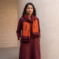 Maroon Kutch Handwoven Merino Wool x Tussar Silk Shibori Tie-Dye Stole, worn by a woman, AI visual of the stole, iTokri