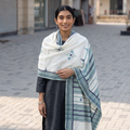 White Kutch Handwoven Mirror Work Acrylic Wool Shawl, worn by a model, AI visual of the shawl, iTokri