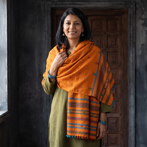 Orange Kutch Handwoven Mirror Work Acrylic Wool Shawl, worn by a model, AI visual of the shawl, iTokri
