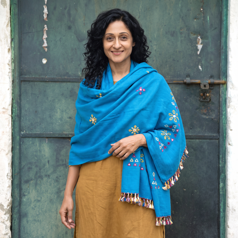 Blue Kutch Handwoven Mirror Work Acrylic Wool Shawl, worn by a model, AI visual of the shawl, iTokri
