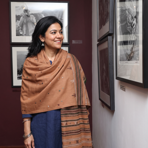 Brown Kutch Handwoven Mirror Work Acrylic Wool Shawl, worn by a model, AI visual of the shawl, iTokri