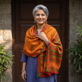Orange Kutch Handwoven Mirror Work Chomuk Buta Acrylic Wool Shawl, worn by a model, AI visual of the shawl, iTokri