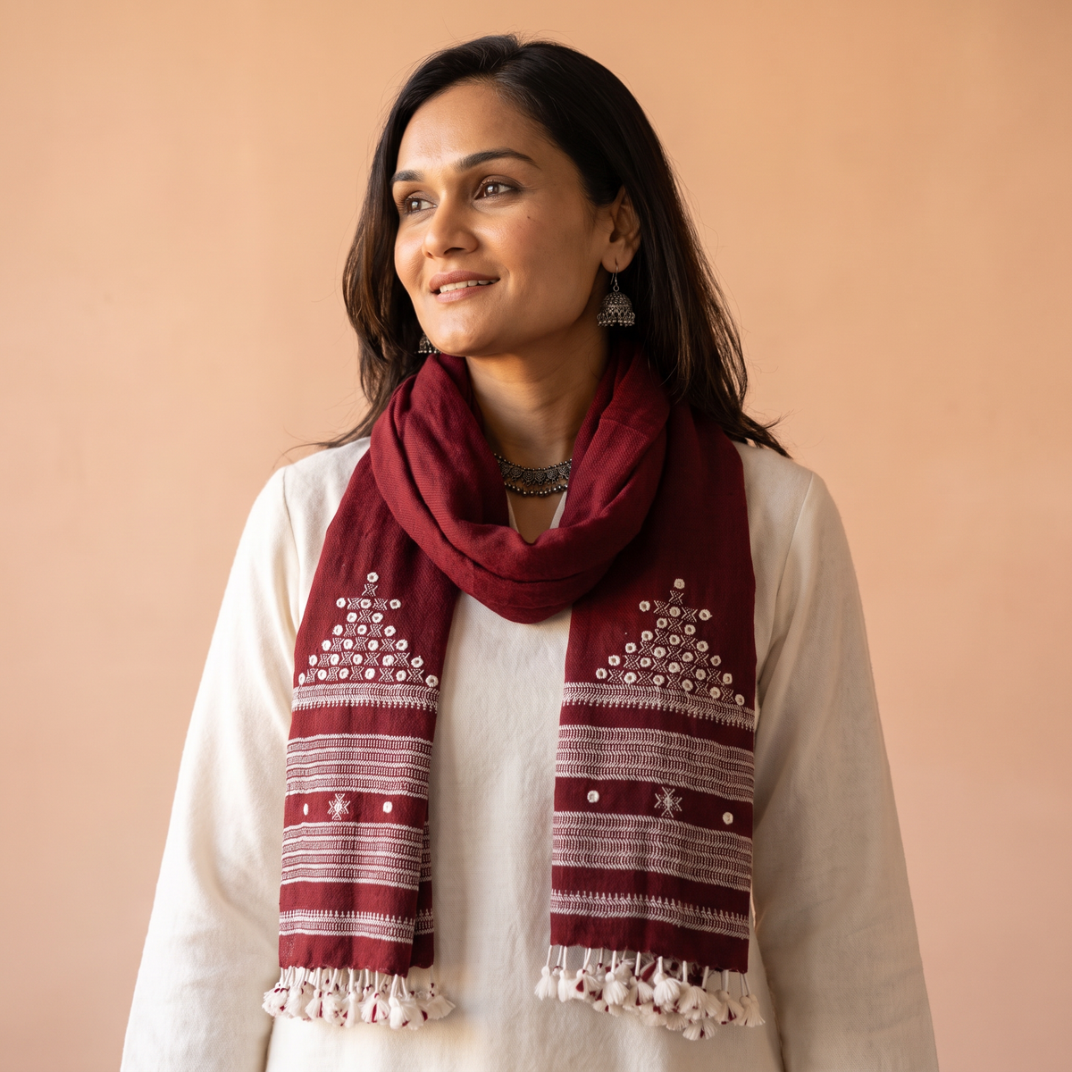 Maroon Kutch Handwoven Mirror Work Merino Wool Embroidered Stole, worn by a woman, AI visual of the stole, iTokri
