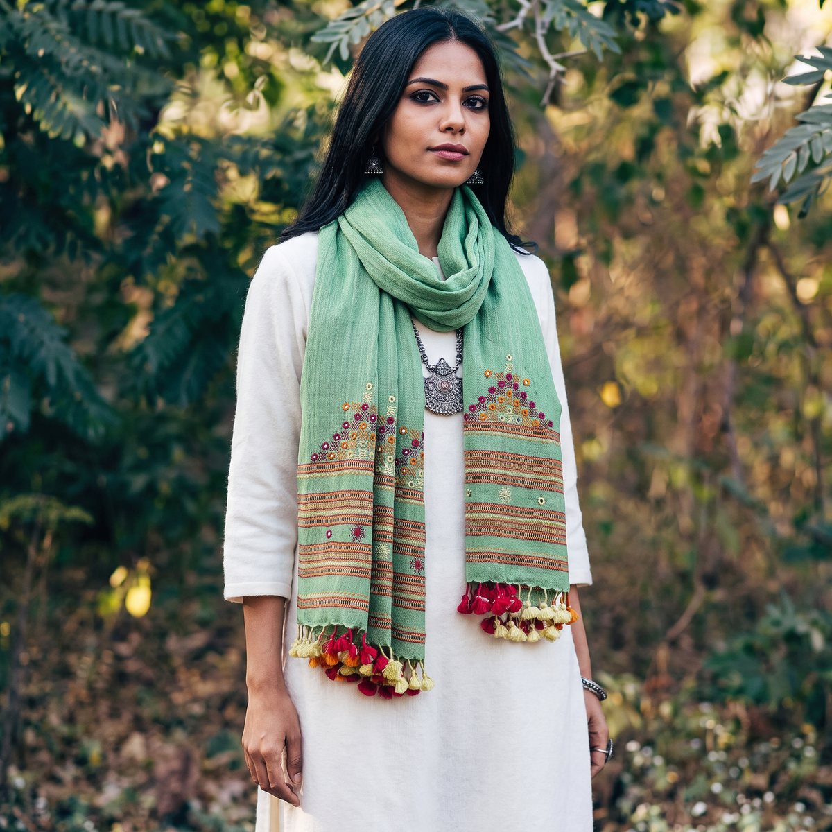 Green Kutch Handwoven Mirror Work Merino Wool Embroidered Stole, worn by a woman, AI visual of the stole, iTokri