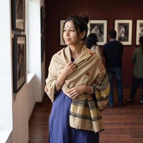 Beige Kutch Neran Hand Embroidery Mirror Work Acrylic Woollen Shawl, worn by a model, AI visual of the shawl, iTokri