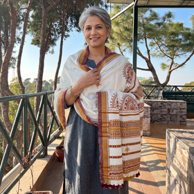 White Kutch Neran Hand Embroidery Mirror Work Acrylic Woollen Shawl, worn by a model, AI visual of the shawl, iTokri
