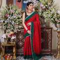 Red and green Kutch tie-dye Bandhani cotton saree, draped and worn by a woman, by artisan Shabana Khatri, AI visual of the saree, iTokri