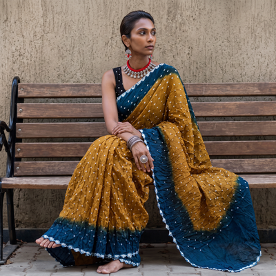 Mustard yellow and blue Kutch tie-dye Bandhani cotton saree, draped and worn by a woman, by artisan Shabana Khatri, AI visual of the saree, iTokri