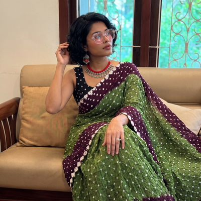 Green and maroon Kutch tie-dye Bandhani cotton saree, draped and worn by a woman, by artisan Shabana Khatri, AI visual of the saree, iTokri
