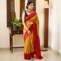 Mustard yellow and red Kutch tie-dye Bandhani cotton saree, draped and worn by a woman, by artisan Shabana Khatri, AI visual of the saree, iTokri
