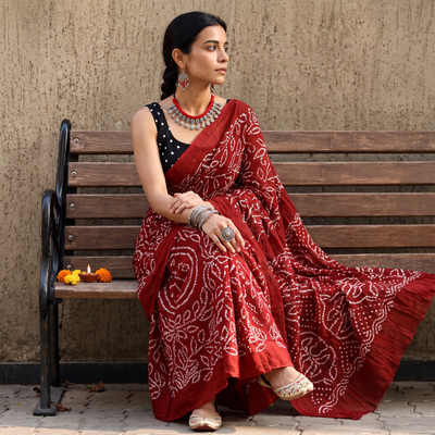 Maroon Kutch tie-dye cotton Bandhani saree, draped and worn by a woman, AI visual of the saree, iTokri
