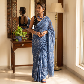 Grey Kutch tie-dye cotton Bandhani saree, draped and worn by a woman, AI visual of the saree, iTokri