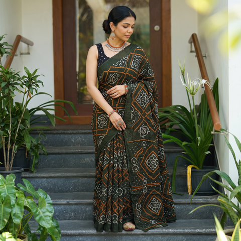 Green Kutch tie-dye cotton Bandhani saree, draped and worn by a woman, AI visual of the saree, iTokri