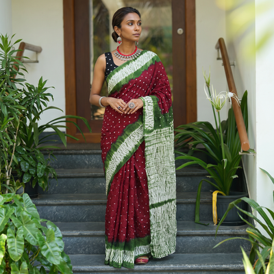 Maroon Kutch tie-dye cotton Bandhani saree, draped and worn by a woman, AI visual of the saree, iTokri