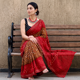 Brown Kutch tie-dye cotton Bandhani saree, draped and worn by a woman, AI visual of the saree, iTokri
