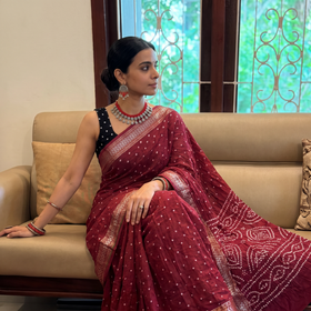 Purple Kutch tie-dye pure cotton Bandhani saree with border, draped and worn by a woman, AI visual of the saree, iTokri