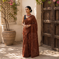 Brown Kutch tie-dye pure mul cotton rai Bandhani saree, draped and worn by a woman, AI visual of the saree, iTokri