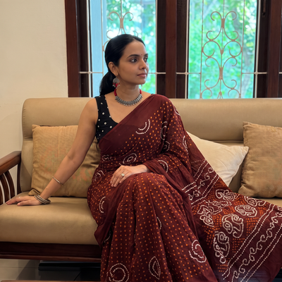 Maroon Kutch tie-dye pure mul cotton rai Bandhani saree, draped and worn by a woman, AI visual of the saree, iTokri