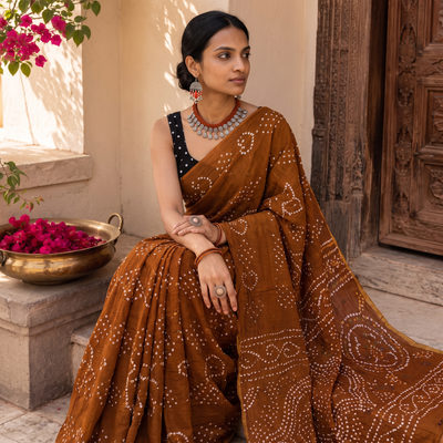 Brown Kutch tie-dye pure mul cotton rai Bandhani saree, draped and worn by a woman, AI visual of the saree, iTokri
