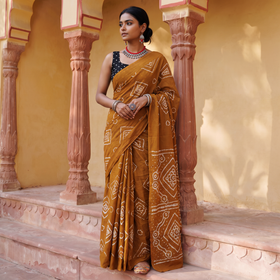 Brown Kutch tie-dye pure mul cotton rai Bandhani saree, draped and worn by a woman, AI visual of the saree, iTokri