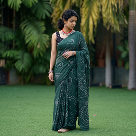 Green Kutch tie-dye pure mul cotton rai Bandhani saree, draped and worn by a woman, AI visual of the saree, iTokri