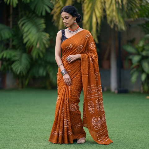 Orange Kutch tie-dye pure mul cotton rai Bandhani saree, draped and worn by a woman, AI visual of the saree, iTokri