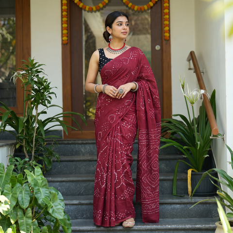 Red Kutch tie-dye pure mul cotton rai Bandhani saree, draped and worn by a woman, AI visual of the saree, iTokri