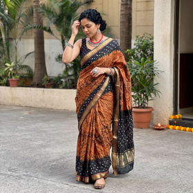 Brown and black Kutch tie-dye Shibori Bandhani cotton saree, draped and worn by a woman, by artisan Shabana Khatri, AI visual of the saree, iTokri