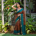 Brown and teal Kutch tie-dye Shibori Bandhani cotton saree, draped and worn by a woman, by artisan Shabana Khatri, AI visual of the saree, iTokri