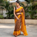 Brown and mustard yellow Kutch tie-dye Shibori Bandhani cotton saree, draped and worn by a woman, by artisan Shabana Khatri, AI visual of the saree, iTokri