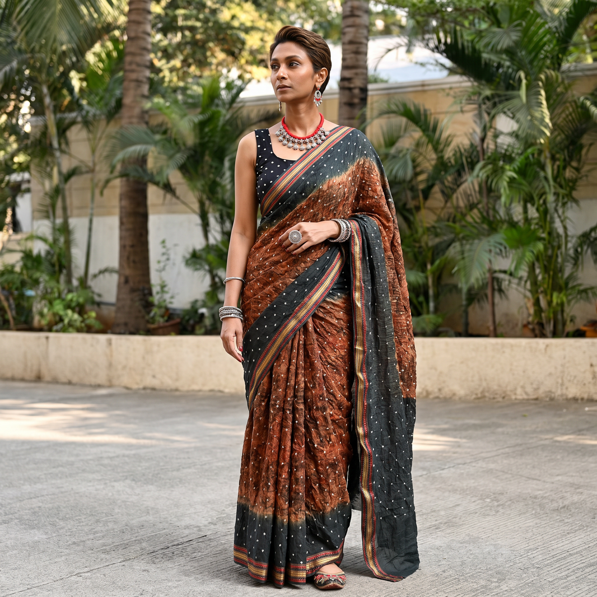 Brown and grey Kutch tie-dye Shibori Bandhani cotton saree, draped and worn by a woman, by artisan Shabana Khatri, AI visual of the saree, iTokri