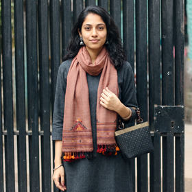 Brown Kutch Weaving Handwoven Merino Woollen Stole, worn by a woman, AI visual of the stole, iTokri